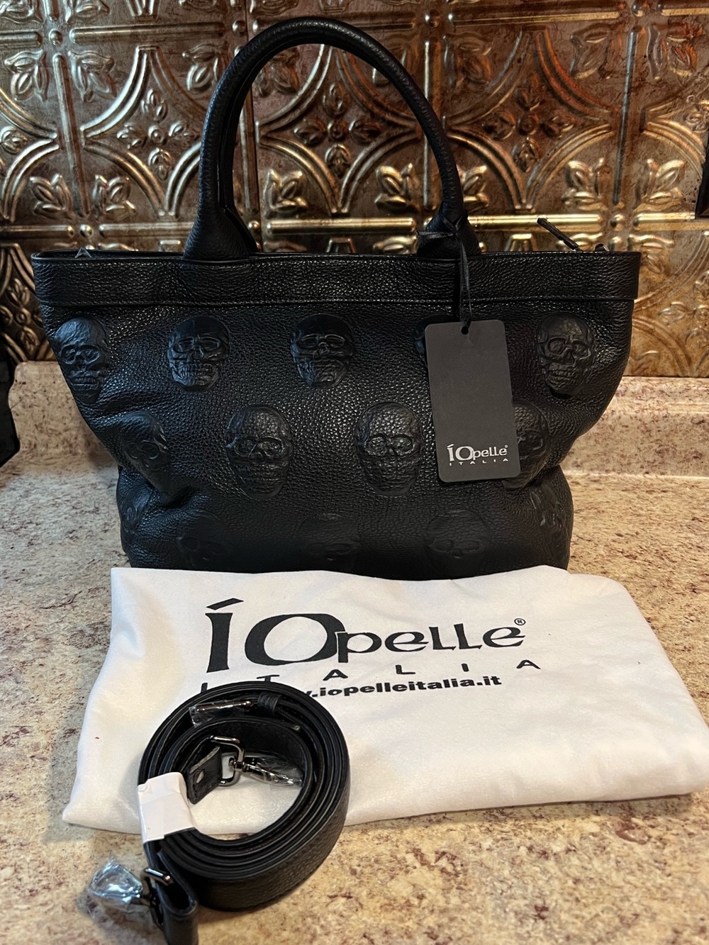 iO Pelle Embossed Multi Skull Satchel NWT